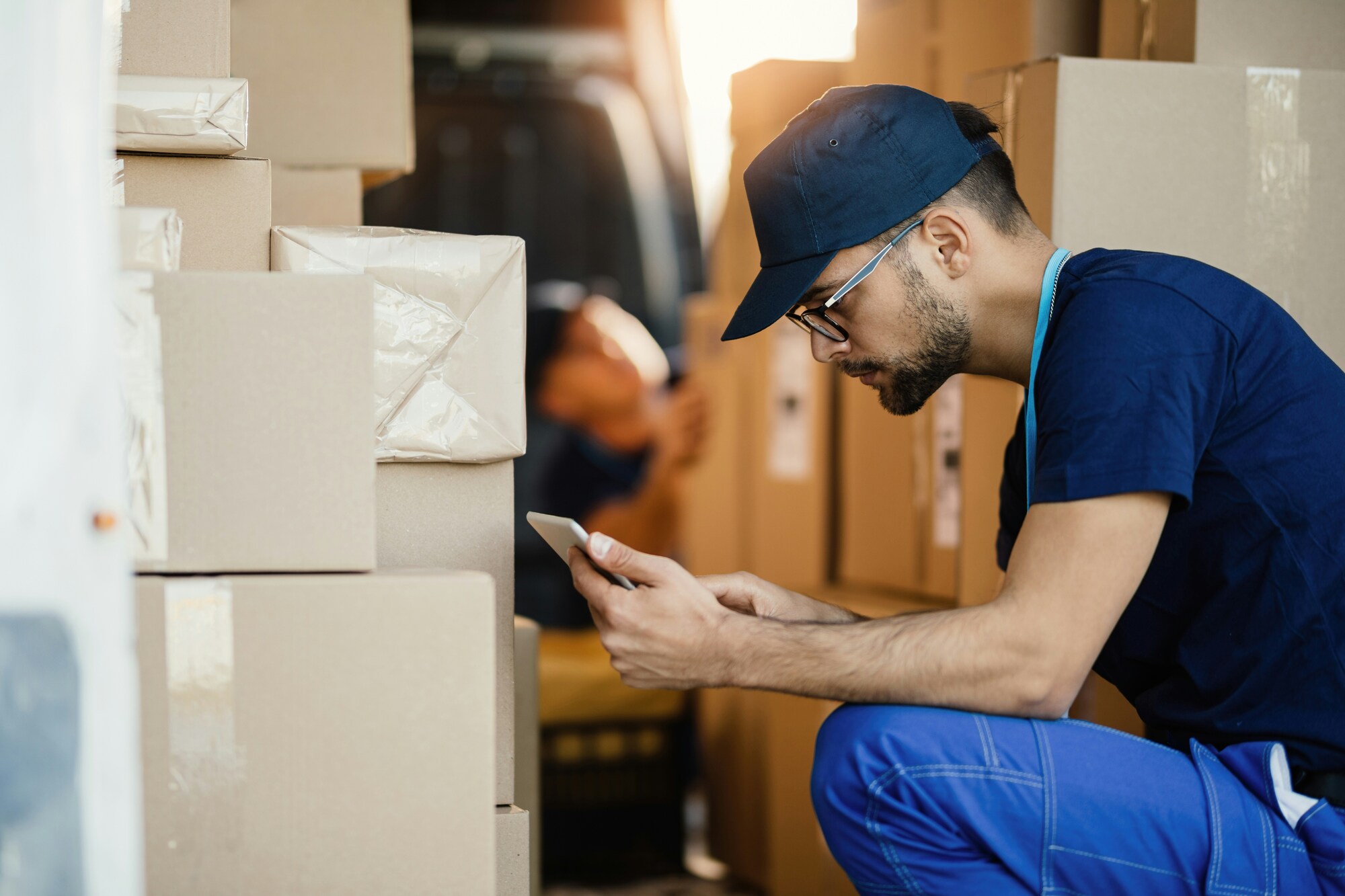 Delivery driver checking parcels